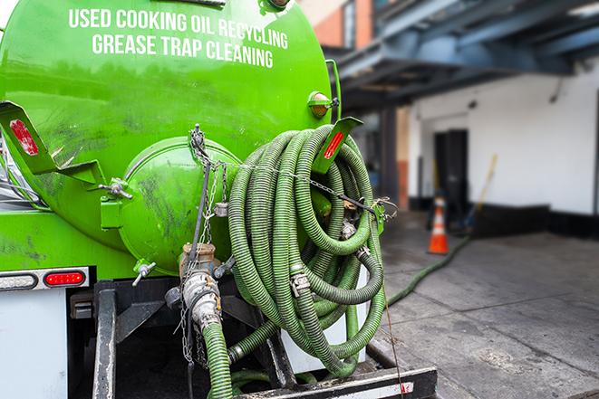 pump truck removing waste from a grease trap in Hampton